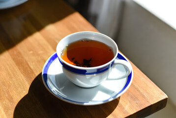cup of tea on the woden table