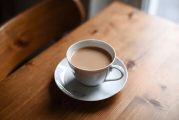 cup of tea on the woden table