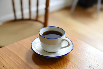 cup of tea on the woden table