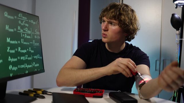 Student continues biohacking experiment adjusting wearable led device on arm at home lab studying health data science limits curiosity ambition and future human potential