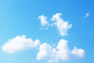 Bright blue sky with white clouds