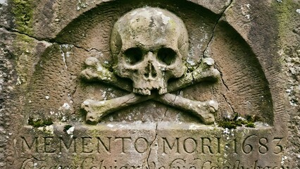 Carved Skull and Crossbones on Tombstone.