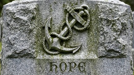 Ancient Stone Carving with Anchor and Hope.