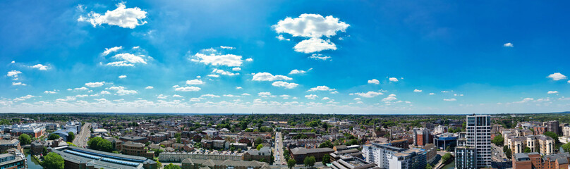 Fototapeta premium High Angle Ultra Wide Panoramic View of Iconic Buildings at Central Reading London City and Town Centre. Aerial Drone Tour of England United Kingdom. July 11th, 2025