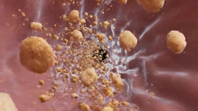 CGI Animation of Food Particles Obstructing Airway Passage During Choking Incident with a Pink Anatomical Structure Background for Medical Education