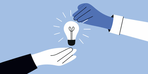 Sharing a bright idea two hands connecting around a glowing lightbulb