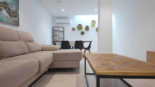 Spacious basement lounge with dining and TV area