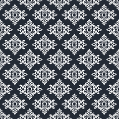 Seamless  black decorative wallpaper pattern.Seamless floral ornament on background.