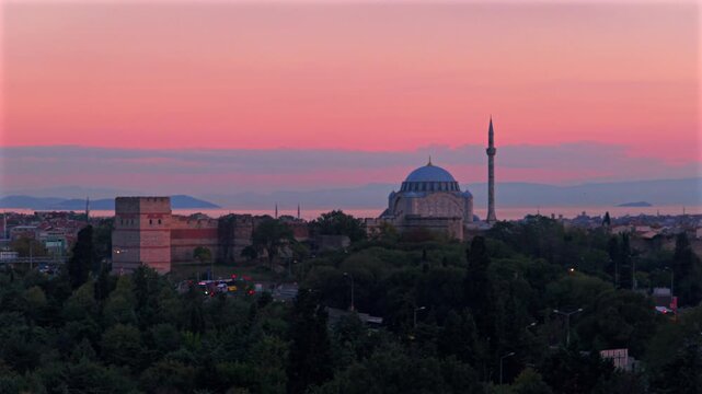 Sunset golden hour pink purple afterglow sky Yenikapı Blue Mosque synagogue Istanbul Turkey T&uuml;rkiye aerial drone panoramic landscape cityscape Bosphorus Strait harbor view traffic cars upwards motion