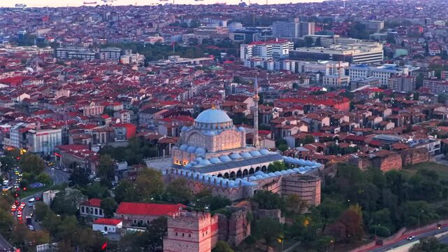 Golden hour pink sunset afterglow sky cargo ships Yenikapı Port Istanbul Turkey T&uuml;rkiye aerial drone Blue Mosque synagogue temple landscape cityscape Bosphorus Strait harbor view backwards pan up