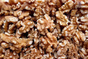 A cross-section showing the delicate texture of a walnut. A close-up of several walnuts.