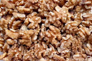 A cross-section showing the delicate texture of a walnut. A close-up of several walnuts.