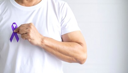 Purple Ribbon Held on a White T-shirt Signifying Awareness and Support for Cancer Patients and Survivors