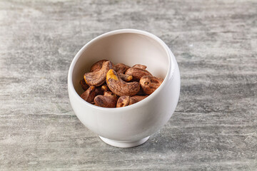 Unpeeled cashew nuts in the bowl