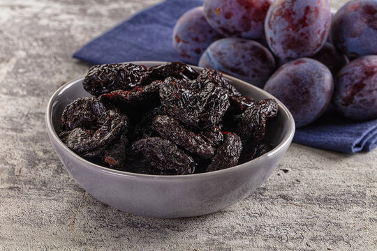 Black dry sweet prunes heap