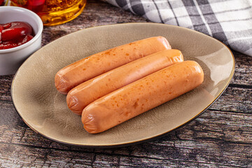 Boiled sausages with ketchup