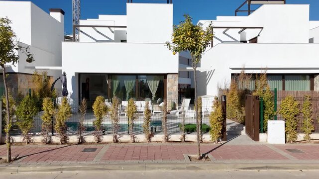 Modern white villa with private patio and plunge pool view
