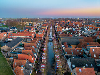 Aerial drone view of Harlingen Christmas market at sunset