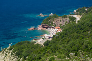 Fototapeta premium Aerial View of Serene Beach with Clear Blue Waters