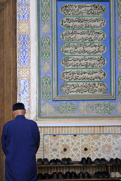 Muslim praying in Bolo Haouz mosque, Bukhara, Uzbekistan