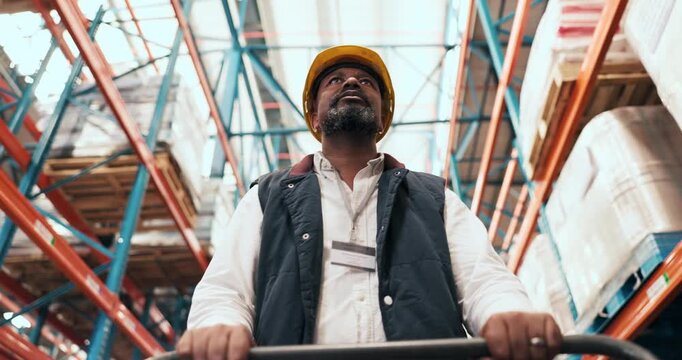 Logistics, black man and walking with trolley in warehouse for transport, backlog control or delivery. Below, shipping picker and cart in factory for inventory, storage management or supply chain