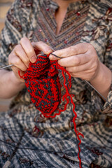 Uzbek woman knitting in Itchan Kala, Khiva old city, Uzbekistan