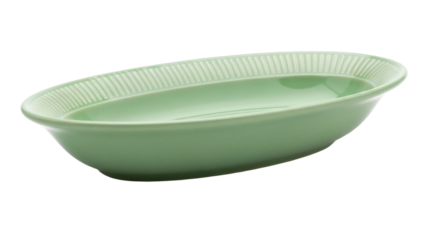 Isolated mint green oval ceramic serving bowl with ridged rim on bright background, kitchenware
