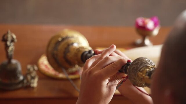 Close-Up of Tibetan Buddhist Monk Playing Traditional Ritual Musical Instrument