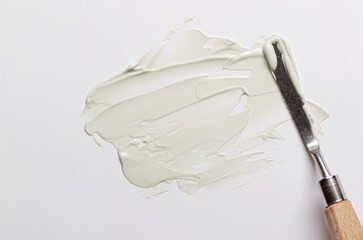 The texture of cosmetic moisturizer with palette knife