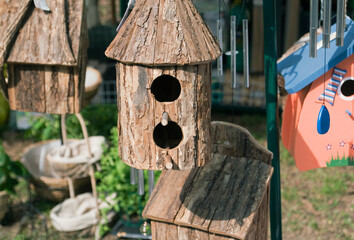 group of bird houses hanging outdoors