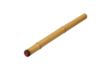 Bamboo smoking pipe glowing with burning embers