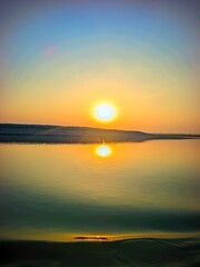Obraz premium Tranquil Nature Background With Sunset and Smooth Water 