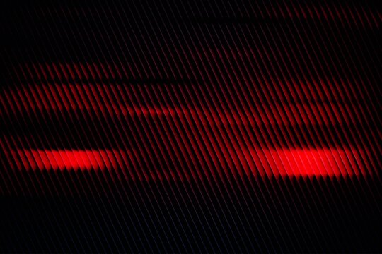 Dark abstract red light background with horizontal glow streaks and cinematic mood for modern design, technology visuals, creative wallpapers, branding