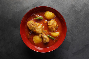 Bengali style spicy chicken curry stew with potato leg piece recipe ingredients tomato ginger gallic onion cumin coriander garam masala salt turmeric chili