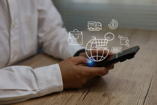 Business professional using smartphone for online shopping and global e-commerce, digital icons for cart, sale, payment, delivery cash back, representing mobile commerce, fintech, retail technology. - Powered by Adobe