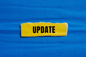 Update message written on ripped torn paper background. Conceptual Update symbol. Copy space.