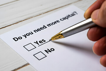 "Do you need more capital?" Question on White Paper with Check Boxes Business Concept
