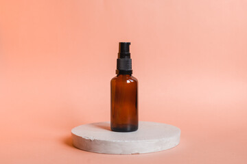 Different serum cosmetic bottles, white and dark brown dropper bottle container and packaging skincare product. studio pastel light background.