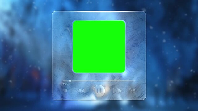 A winter music player interface with a frozen glass effect and a green screen. A music player made of ice with a green screen against a snowfall backdrop. Play a track in one minute.