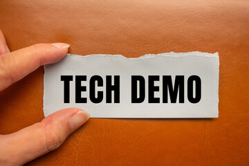 Tech Demo message written on ripped torn paper background. Conceptual Tech Demo symbol. Copy space.