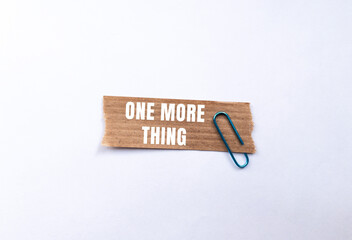 One More Thing message written on ripped torn paper background. Conceptual One More Thing symbol. Copy space.