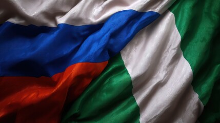 Obraz premium Display of Russian and Nigerian flags showing their colors and designs together on a textured surface