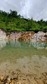Panning right to reveal the ethereal scene of JABA sulfur lagoon, a popular local tourist attraction in Tanjay, Negros Oriental, Philippines