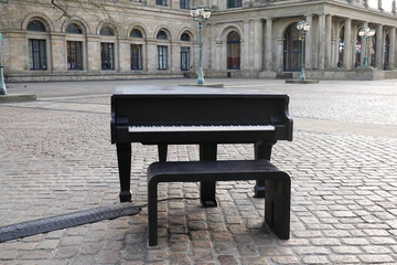 public grand piano made out of concrete on city square in front of opera house in Hannover Germany
