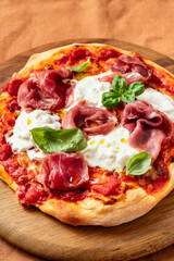 Pizza with Prosciutto Crudo, Stracciatella Cheese and Basil