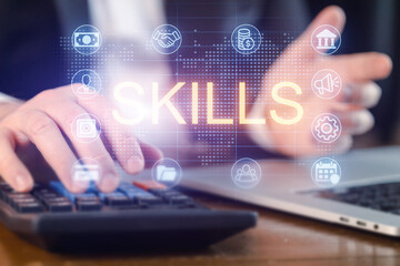 Using skills to calculate finances and manage tasks at a workspace with a laptop and calculator present