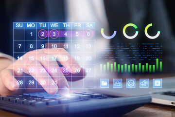 Scheduling tasks while analyzing data with digital tools for productivity at an office desk in the afternoon