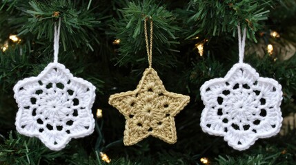 white crochet snowflakes and one gold star ornament hanging on the christmas tree