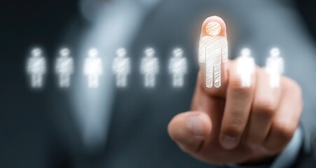 A man is pointing at a group of people on a screen