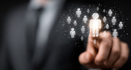 A man in a suit is pointing at a group of people in a crowd